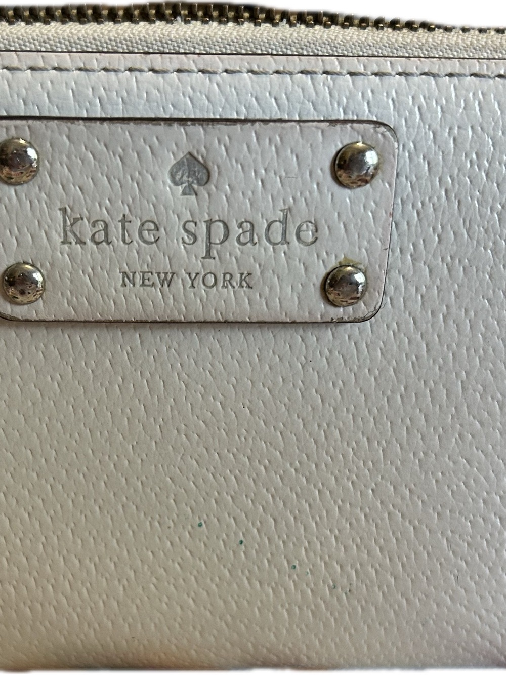 kate spade white leather wristlet with silver-tone logo plate